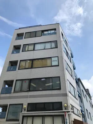 a tall building with windows on the side of it at GLAMPEACE\u845b\u98fe\u30fb\u56db\u30c4\u6728 in Tokyo