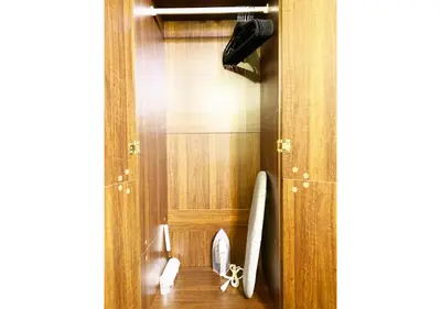 a bathroom with a door with a surfboard in it at GLAMPEACE\u845b\u98fe\u30fb\u56db\u30c4\u6728 in Tokyo