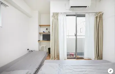 a bedroom with a bed and a window at Marvelous Kinshicho - Vacation STAY 12770v in Tokyo