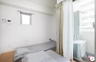 a white bedroom with a bed and a window at Marvelous Kinshicho - Vacation STAY 12770v in Tokyo