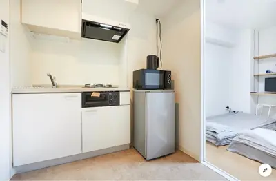 a kitchen with a refrigerator and a microwave at Marvelous Kinshicho - Vacation STAY 11878v in Tokyo