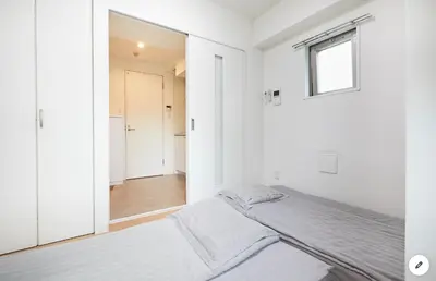 a white bedroom with a bed and a window at Marvelous Kinshicho - Vacation STAY 12904v in Tokyo