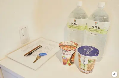 a table with two bottles of water and a pen at Marvelous Kinshicho - Vacation STAY 12904v in Tokyo