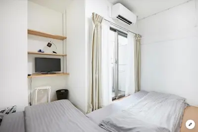 a white bedroom with a bed and a window at Marvelous Kinshicho - Vacation STAY 12965v in Tokyo