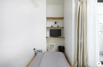 a bedroom with a bed and a tv and a window at Marvelous Kinshicho - Vacation STAY 12965v in Tokyo