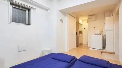 a bedroom with a blue bed in a room at Marvelous Kinshicho - Vacation STAY 13097v in Tokyo