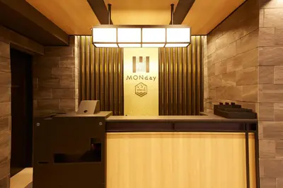 a lobby with a counter with a laptop on it at MONday Apart Premium UENO OKACHIMACHI in Tokyo