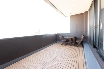 a room with a table and chairs in a building at \u706f\u5149\u65c5\u9928 Light hotel in Tokyo
