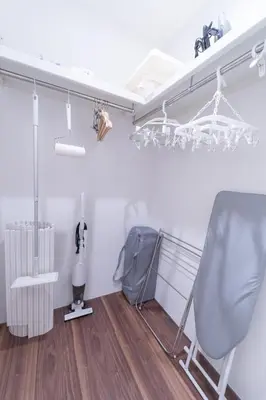 a living room with a chair and a radiator at SATELLITE HOTEL Ebisu \u30b5\u30c6\u30e9\u30a4\u30c8\u30db\u30c6\u30eb\u6075\u6bd4\u5bff in Tokyo