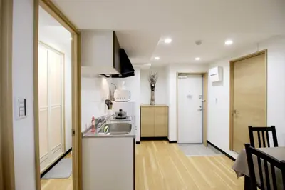 a kitchen with a sink and a counter top at Uhome\u5343\u99c4\u6728\u9759\u96c5\u6c11\u5bbf\u65c5\u9986 in Tokyo