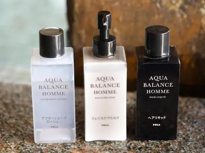 a couple of bottles of shampoo and conditioner on a counter at Dormy Inn Ikebukuro - Natural Hot Spring in Tokyo