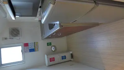a small room with a window and a stove at Isshuku Ryokan Asakusabashi - Vacation STAY 17363v in Tokyo
