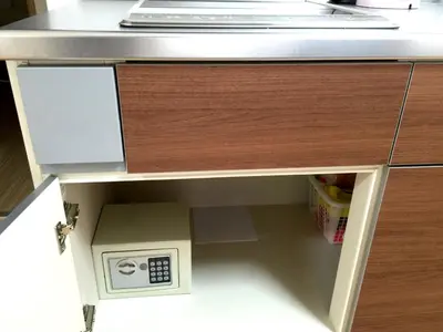 a kitchen island with a microwave in a drawer at Isshuku Ryokan Asakusabashi - Vacation STAY 17346v in Tokyo