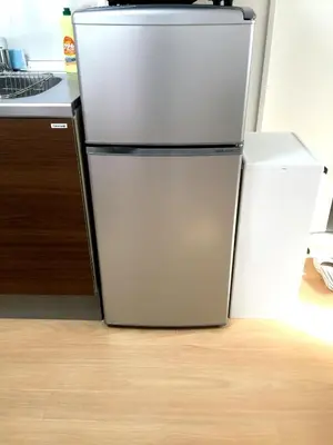 a refrigerator in a kitchen next to a counter at Isshuku Ryokan Asakusabashi - Vacation STAY 17346v in Tokyo