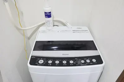 a water bottle is sitting on top of a machine at HOTEL AIS HATAGAYA in Tokyo
