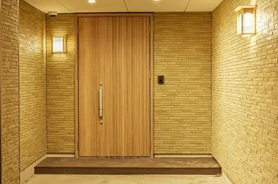 a hallway with a wooden door in a brick wall at 634 Condo Yotsuya - Vacation STAY 14799v in Tokyo