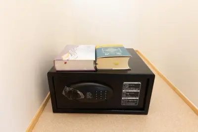 a microwave with books on top of it at Light Hotel - Vacation STAY 17340v in Tokyo