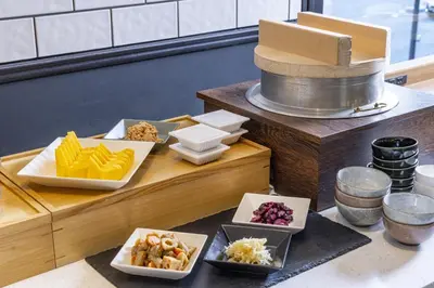 a buffet with plates of food on a table at Tokyu Stay Shinjuku Eastside in Tokyo