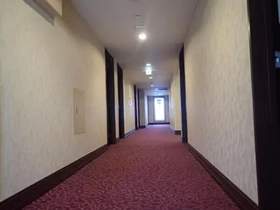an empty hallway with a red carpeted corridor at Hotel Suntargas Ueno - Vacation STAY 08474v in Tokyo