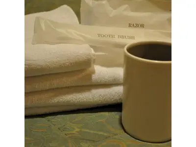 a pile of towels and a coffee cup on a table at Hotel Suntargas Ueno - Vacation STAY 08481v in Tokyo