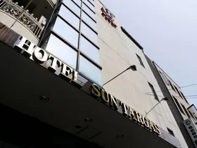a building with a sign on the side of it at Hotel Suntargas Ueno - Vacation STAY 08481v in Tokyo