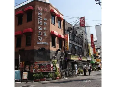 a building with signs on the side of a street at Hotel Suntargas Ueno - Vacation STAY 08481v in Tokyo