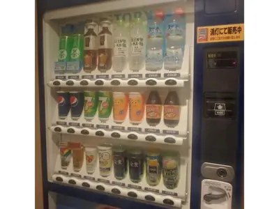 a refrigerator filled with lots of bottles of drinks at Hotel Suntargas Ueno - Vacation STAY 08468v in Tokyo