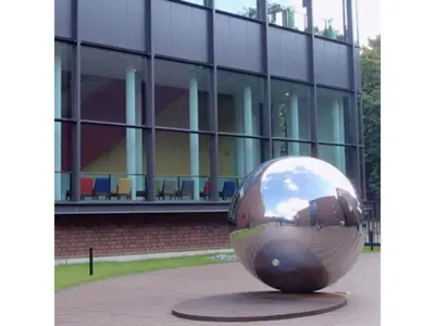 a large metal ball in front of a building at Hotel Suntargas Ueno - Vacation STAY 08468v in Tokyo