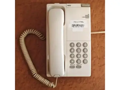 a white phone with a corded handset at Hotel Suntargas Ueno - Vacation STAY 08478v in Tokyo