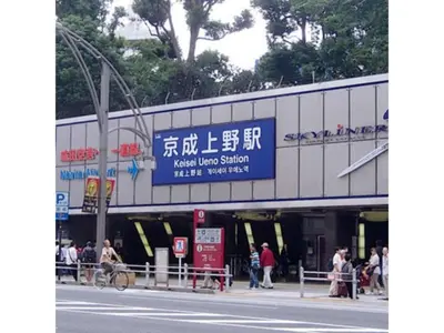 a building with a sign on the side of a street at Hotel Suntargas Ueno - Vacation STAY 08478v in Tokyo