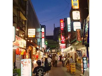 a city street with people walking down a street with signs at Hotel Suntargas Ueno - Vacation STAY 08478v in Tokyo