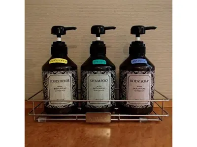 four bottles of soap sitting on a shelf at Hotel Suntargas Ueno - Vacation STAY 08484v in Tokyo