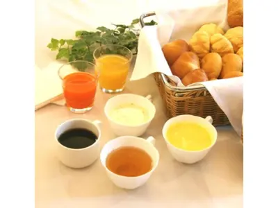 a table topped with different types of drinks and bread at R&B Hotel Tokyo Toyocho - Vacation STAY 14255v in Tokyo