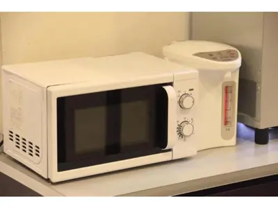 a microwave sitting on top of a counter at R&B Hotel Tokyo Toyocho - Vacation STAY 14234v in Tokyo