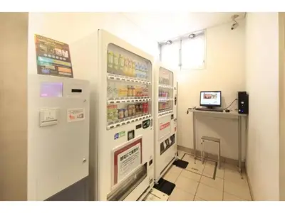 a large white refrigerator in a room with a counter at R & B Hotel Kamata Higashiguchi - Vacation STAY 14841v in Tokyo