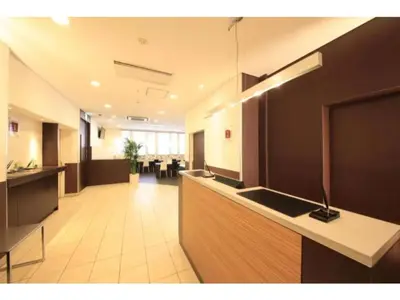 an office lobby with a reception counter and a dining area at R & B Hotel Kamata Higashiguchi - Vacation STAY 14835v in Tokyo
