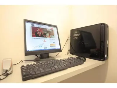 a computer monitor and a keyboard on a desk at R & B Hotel Kamata Higashiguchi - Vacation STAY 14835v in Tokyo