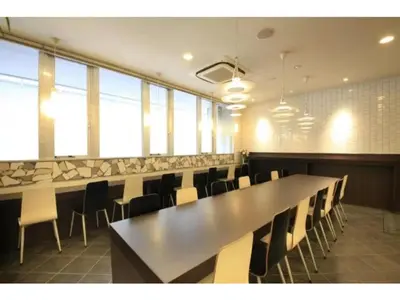 a large conference room with a long table and chairs at R & B Hotel Kamata Higashiguchi - Vacation STAY 14835v in Tokyo