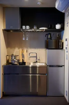 a kitchen with a sink and a refrigerator at 634 Condo Shinjuku - Vacation STAY 14798v in Tokyo
