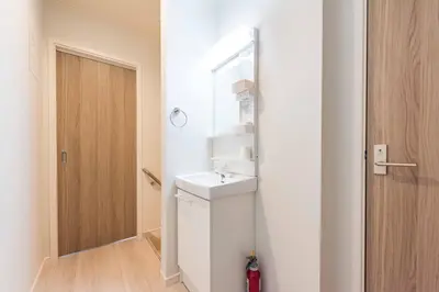 a small bathroom with a sink and a mirror at Terrace house omori in Tokyo