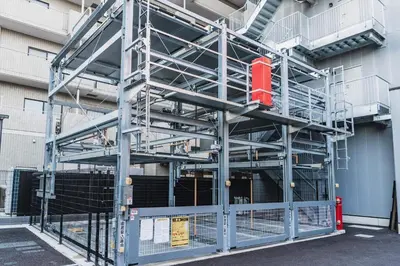 a metal scaffolding system on the side of a building at The Kanzashi Tokyo Asakusa in Tokyo