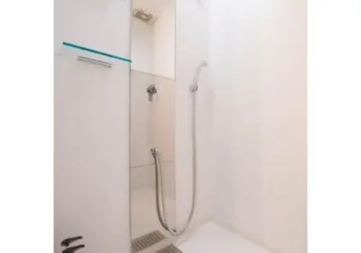 a shower with a glass door in a bathroom at Sakura Sky Hotel - Vacation STAY 18444v in Tokyo