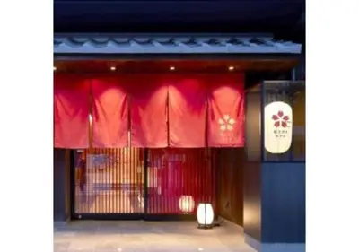 a store front with red curtains and a gate at Sakura Sky Hotel - Vacation STAY 18442v in Tokyo