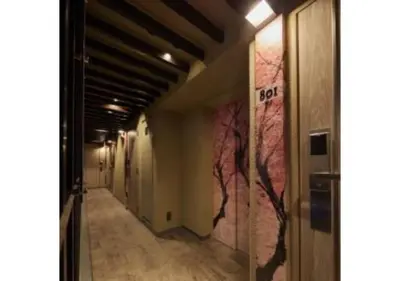 a corridor of a hallway with pink walls at Sakura Sky Hotel - Vacation STAY 18432v in Tokyo