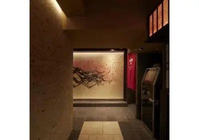 a hallway with a painting of a tree on the wall at Sakura Sky Hotel - Vacation STAY 18449v in Tokyo