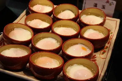 a tray of small cups of food on a table at Almont Hotel Nippori in Tokyo