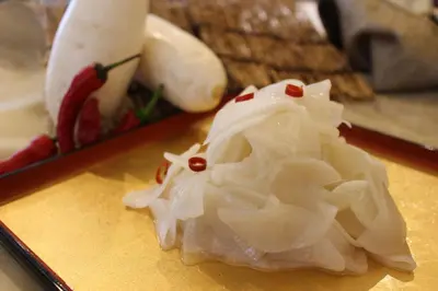 a pile of onions sitting on top of a table at Almont Hotel Nippori in Tokyo