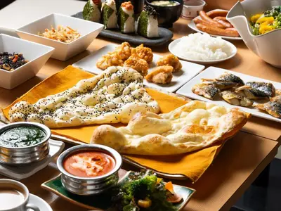 a table topped with plates of food and dips at APA Hotel Ginza Kyobashi Minami Tokyo Station Yaesu South Gate in Tokyo