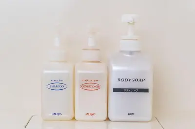 four bottles of body soap sitting next to each other at Pearl Hotel Ryogoku in Tokyo