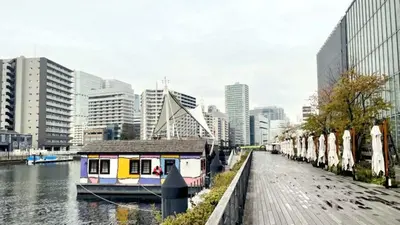 a city with a river and a boat in the water at Toyoko Inn Tokyo Shinagawa Konan-guchi Tennozu Isle in Tokyo